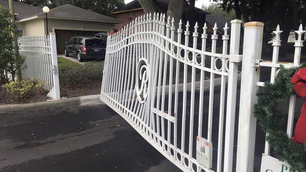 damaged white steel custom gate repaired